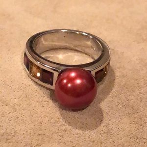 Sterline silver beaded ring with garnet jewels.